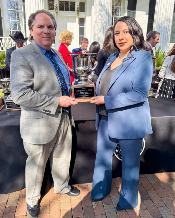 Bret Gardella, Executive Director & CEO, and Kara De La Riva, Director of Workforce & Business Development, representing Greater Brownsville with the Governor's Cup