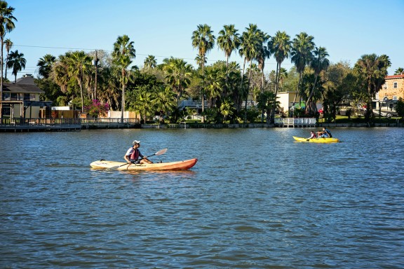 people kayaking on the water